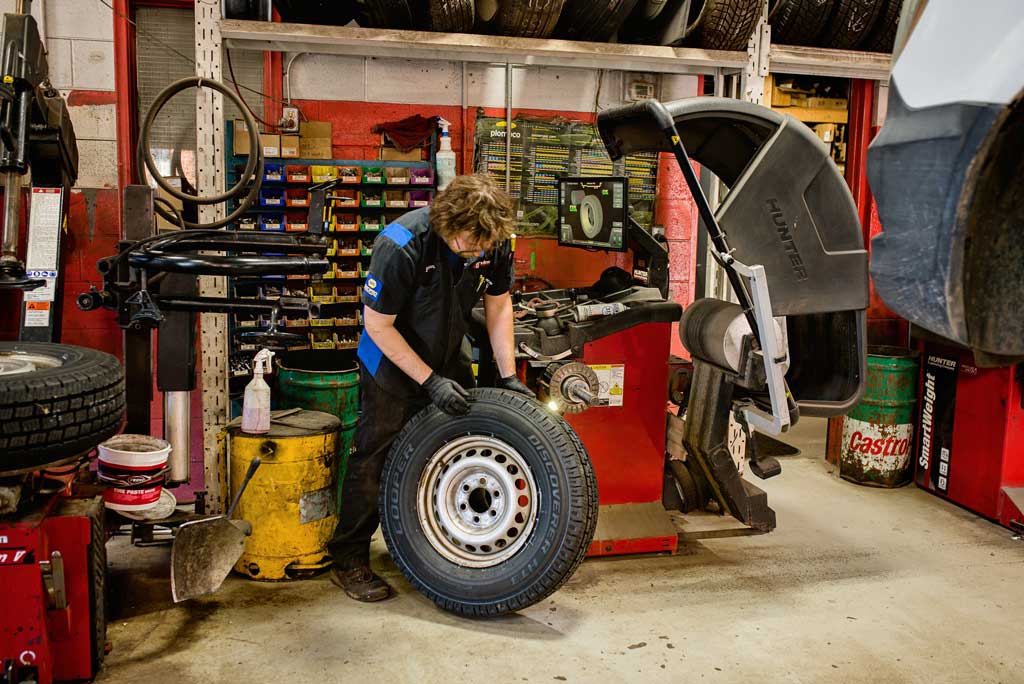 Fairview Tire tires and wheels - professional mechanic in a car workshop