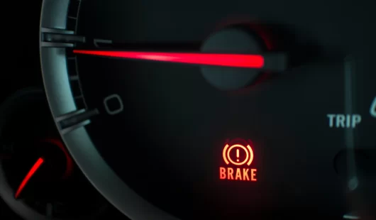 Brake warning light on a dashboard
