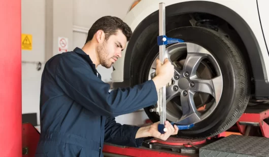 Direction and Wheel alignment at Fairview AutoPro in Burlington - mechanic performing wheel alignment